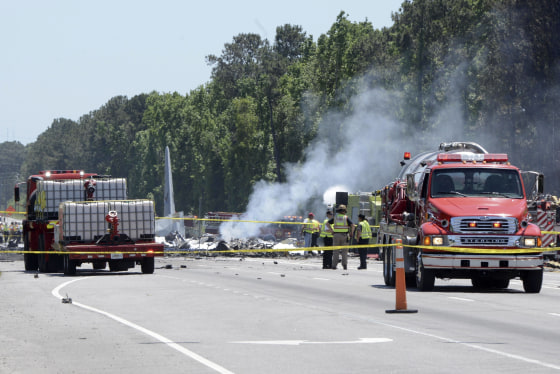 Image: First responders from multiple local and state agencies fight the fires caused by the crash of a C-130 Hercules cargo plane from Puerto Rico Air National Guard, May 2, 2018.
