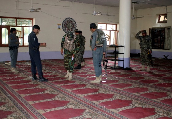 Image: Police inspect a mosque after a blast in Khost province, Afghanistan