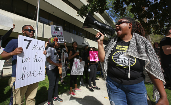 Protesters call for the indictment of police officers involved in the shooting death of Stephon Clark in Sacramento, California.