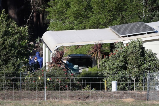 Image: Police forensics investigate the death of seven people