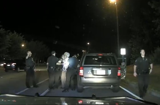 Image: Dash cam video footage shows officers dragging a Rose Campbell out of her vehicle during a traffic stop after she refused to get out.