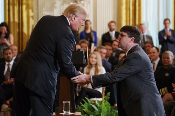 Trump shakes hands with acting Department of Veterans Affairs Secretary Robert Wilkie