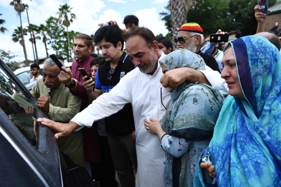 Image: Nasir Shenwari, center, holding his daughter Aunza, grieves as the casket of Santa Fe High School shooting victim Sabika Sheikh leaves