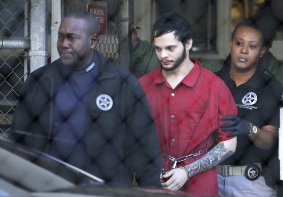 Image: Esteban Santiago is led from the Broward County jail