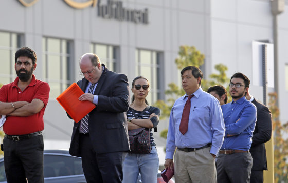 Applicants wait in line to enter a job fair on Aug. 2 at an Amazon fulfillment center, in Kent, Washington.