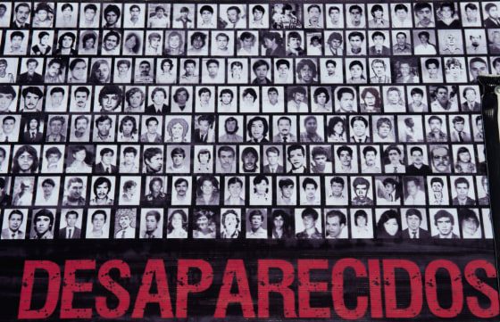 Image: Image: Banner of missing persons shown during a protes in Mexico City in May 2012