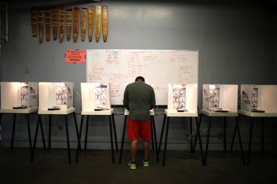 Image: A man votes in the primary election in Los Angeles