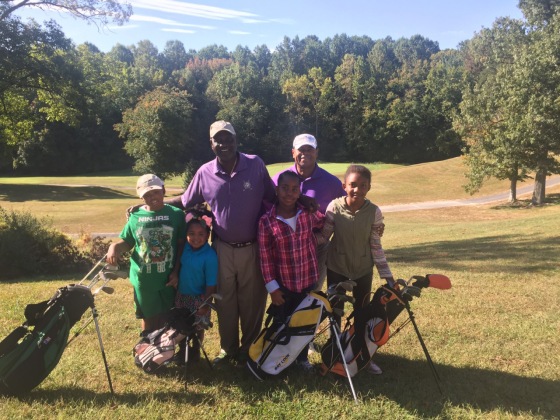 Image: Craig Kirby, back right, with participants in \"Golf. My Future. My Game.\"