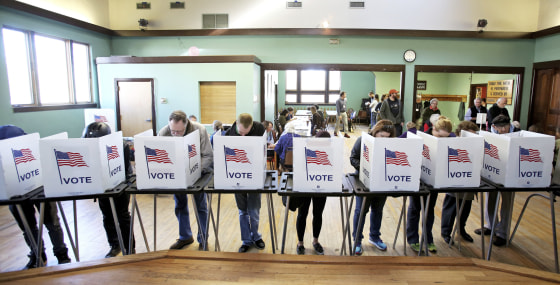 Image: Voters cast their ballots in Madison