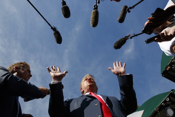 Image: Trump speaks to reporters at the White House