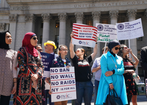 Members of the New York Immigration Coalition hold a news conference in Foley Square