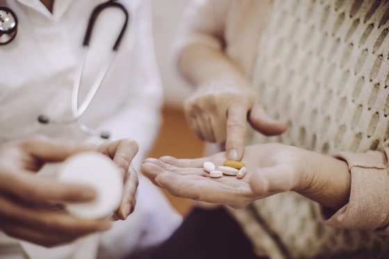 Image: Senior woman at the doctor with medicine