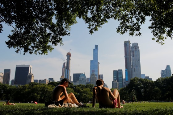 Image: People sunbathe on a hot summer day