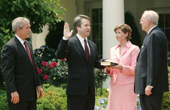 President Bush watches as Brett Kavanaugh is sworn in
