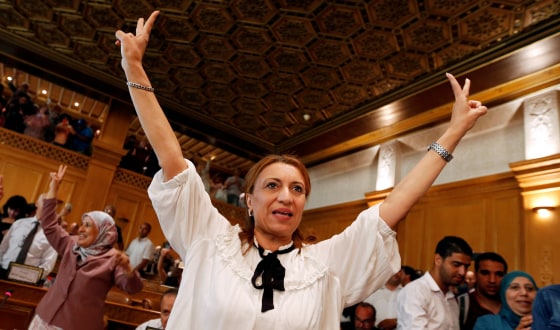 Image: Souad Abderrahim, a candidate of the Islamist Ennahda party celebrates after being elected mayor of the city of Tunis