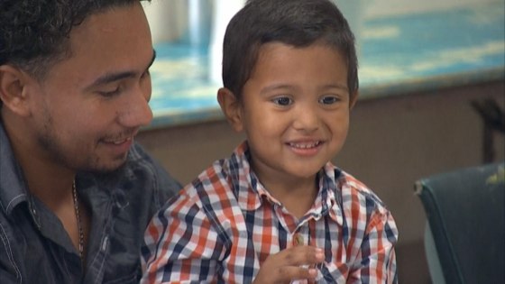 A migrant father with his son Wednesday at the Annunciation House in El Paso, Texas, after they were reunited.