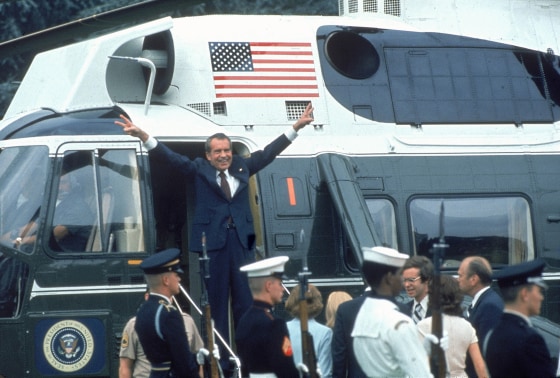Image: Pres. Richard Nixon w. arms outstretched w. veed f