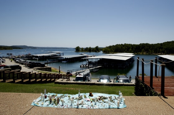 Image: A memorial for the victims of Thursday's duck boat accident overlooks Table Rock Lake in Branson
