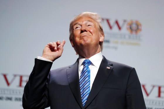Image: Trump takes to the stage to address to the Veterans of Foreign Wars convention in Kansas City