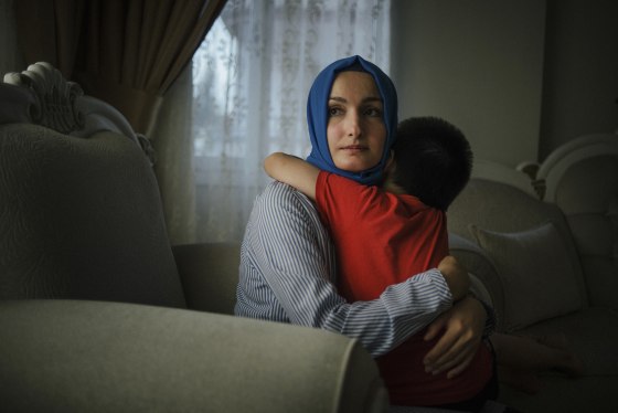 Kubra Golge, the wife of Serkan Golge, an American citizen and NASA scientist, with one of her sons at her home in Hatay, Turkey.