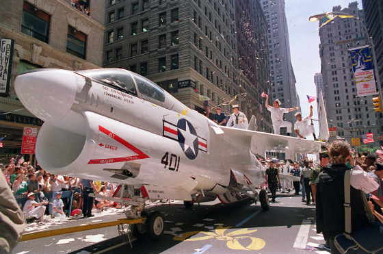 A Navy A-7 Corsair jet is pulled down Br
