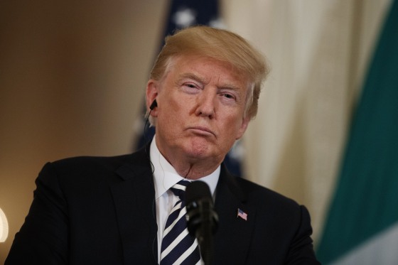 Image: Trump listens to Italian Prime Minister Giuseppe Conte