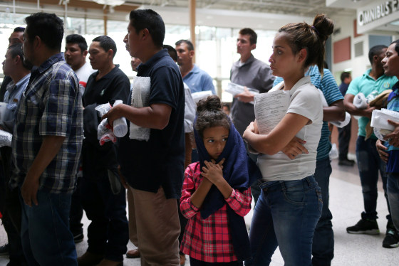 Image: Undocumented immigrant families are released from detention at a bus depot in McAllen