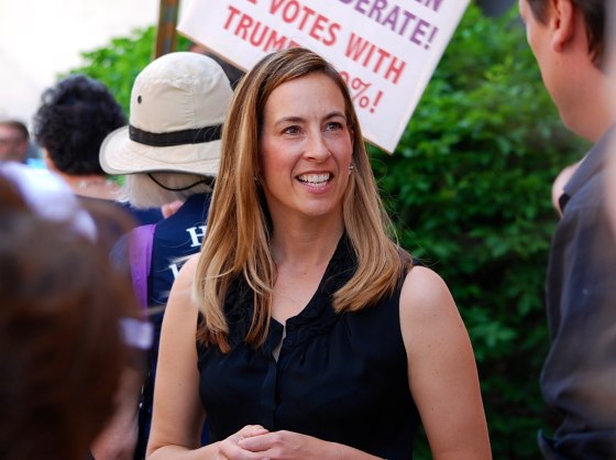 Mikie Sherrill joins protesters outside of U.S. Rep. Rodney Frelinghuysen's office in Morristown, New Jersey, in 2017. Sherrill, a former Navy helicopter pilot and federal prosecutor, is looking to capture a GOP congressional seat in New Jersey.