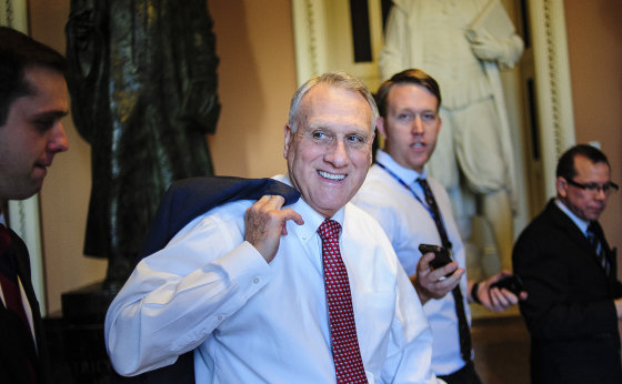 Senate Minority Whip Jon Kyl, a Republican from Arizona, is surrounded by members of the media, as he walks through the U.S. Capitol in Washington on Dec. 30, 2012.