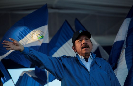 Image: Nicaraguan President Daniel Ortega waves to supporters during a march called \"We walk for peace and life. Justice\" in Managua