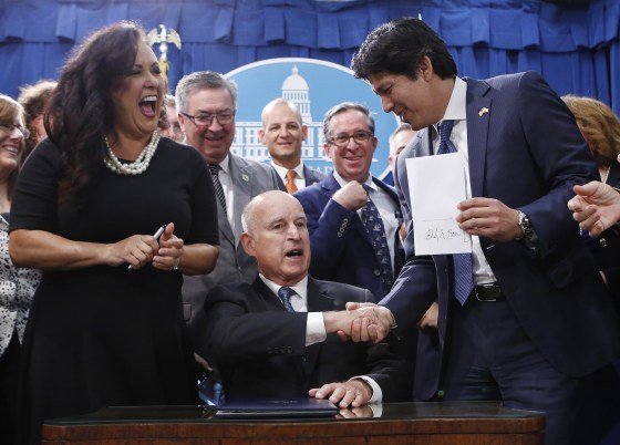 Image: Gov. Jerry Brown signs environmental measure SB100