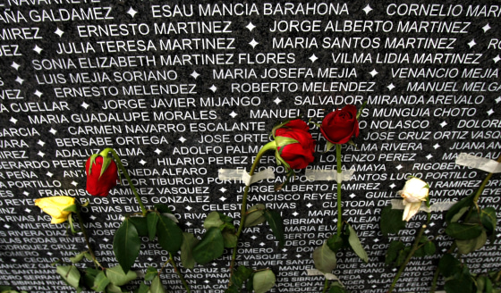 Roses cover a monument carved with the names of people who disappeared during El Salvador's 1980-1992 civil war on the Day of the Dead in San Salvador, on Nov. 2, 2009.