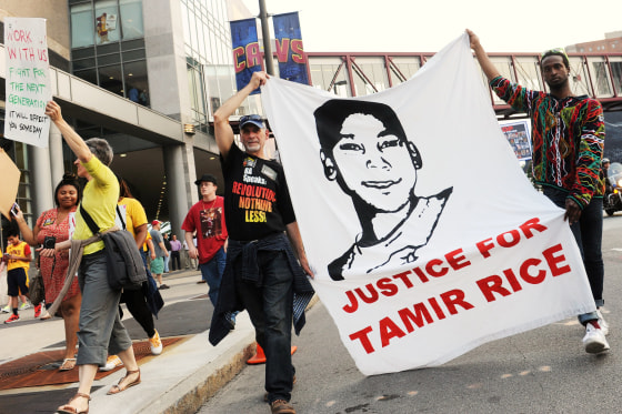 Image: Tadar Muhammad and Jeremy Brustein demonstrate in support of Tamir Rice