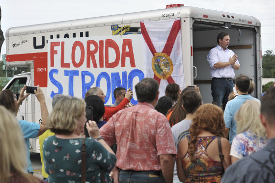 Florida gubernatorial candidate Ron DeSantis combined a campaign stop with a collection drive for water and canned goods ahead of Hurricane Michael at a shopping center in Jacksonville on Oct. 10, 2018.