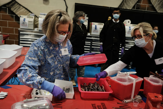 Volunteers sterilize medical supplies at a Remote Area Medical (RAM) mobile dental and medical clinic in Milton