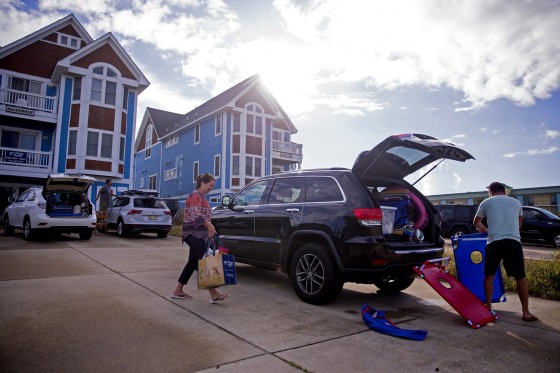 Image: People pack up their cars to prepare to evacuate the Outer Banks area of North Carolina.