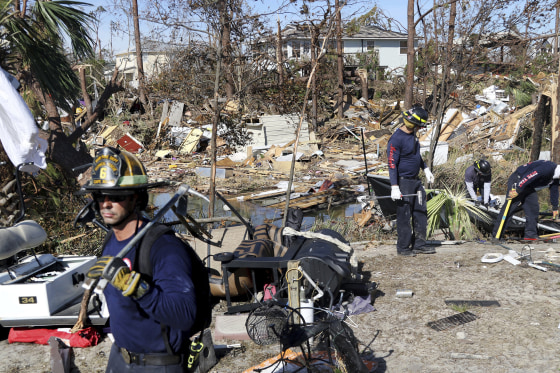 A firefighter searches for survivors in Mexico Beach, Florida, on Friday.
