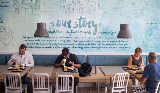 Customers dine at an El Meson Sandwiches restaurant in Orlando, Florida on Oct. 5, 2018.