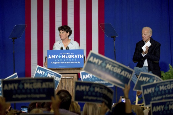 Image: Former Vice President Joe Biden looks on as Democratic congressional candidate Amy McGrath speaks during a campaign event in Owingsville, Kentucky on Oct. 12, 2018.