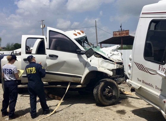Kristin Poland and David Pereira examine on March 31, 2017, the pickup truck involved in a crash