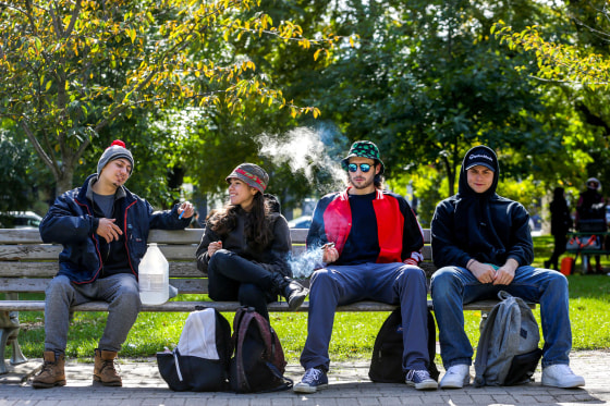 Image: People smoke on the day Canada legalizes recreational marijuana at Trinity Bellwoods Park.
