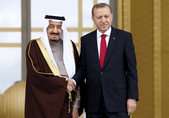Image: Turkey's President Tayyip Erdogan and Saudi King Salman shake hands during a welcoming ceremony in Ankara, Turkey