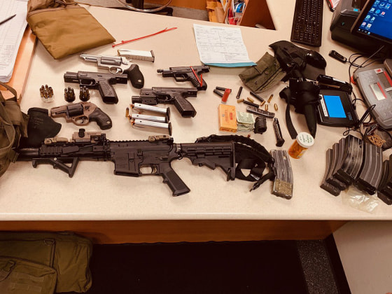 An arsenal of weapons and a bullet-resistant vest were seized after David Goldammer was found sleeping in his car in Miami Beach.