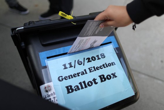 Image: A woman votes in the U.S. congressional and gubernatorial midterm elections in Norwalk