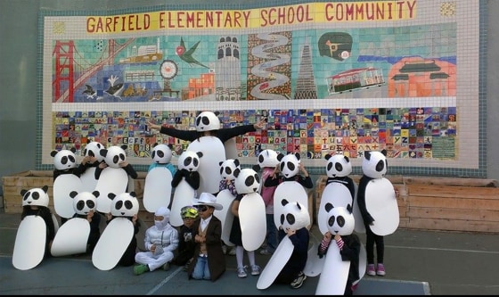Image: Monica Lun and her students in panda costumes