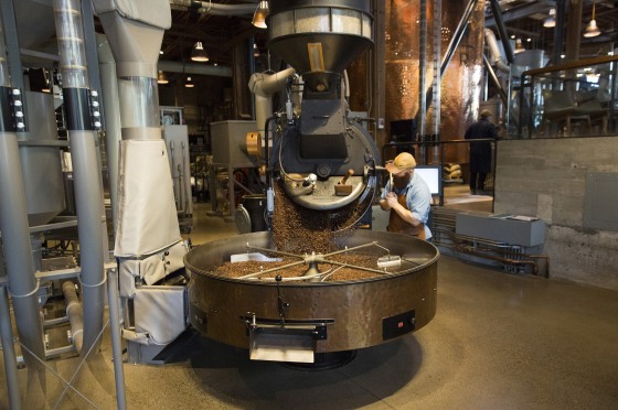 Image: A coffee roaster empties freshly roasted coffee beans from the small-batch roaster at the Starbucks Reserve Roastery and Tasting Room in Seattle
