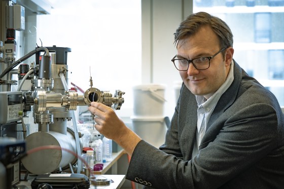 Image: Professor Kasper Moth-Poulsen holding a tube containing the catalyst