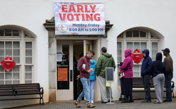 Image: Early voters arrive at a polling station in Athens, Georgia