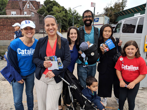 Catalina Cruz gives out flyers in her community.