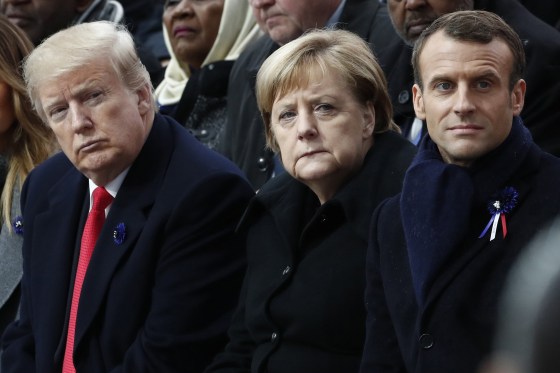 President Donald Trump, German Chancellor Angela Merkel and French President Emmanuel Macron attend a commemoration ceremony for Armistice Day in Paris on Nov. 11, 2018.